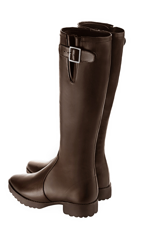 French elegance and refinement for these dark brown knee-high boots with buckles, 
                available in many subtle leather and colour combinations. Record your foot and leg measurements.
We will adjust this beautiful boot with inner zip to your leg measurements in height and width.
The outer buckle allows for width adjustment.
You can customise the boot with your own materials, colours and heels on the "My Favourites" page.
 
                Made to measure. Especially suited to thin or thick calves.
                Matching clutches for parties, ceremonies and weddings.   
                You can customize these knee-high boots to perfectly match your tastes or needs, and have a unique model.  
                Choice of leathers, colours, knots and heels. 
                Wide range of materials and shades carefully chosen.  
                Rich collection of flat, low, mid and high heels.  
                Small and large shoe sizes - Florence KOOIJMAN